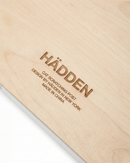 Wooden cat scratching post with 'Hadden' branding and text.