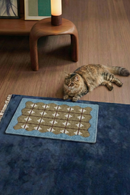 Blue HÄDDEN cat rug with geometric pattern and soft textured surface