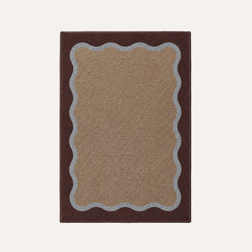 HADDEN Rectangular rug with scalloped edge in brown and beige on a white background