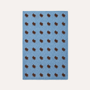 HADDEN Blue rug with brown star patterns on a white background