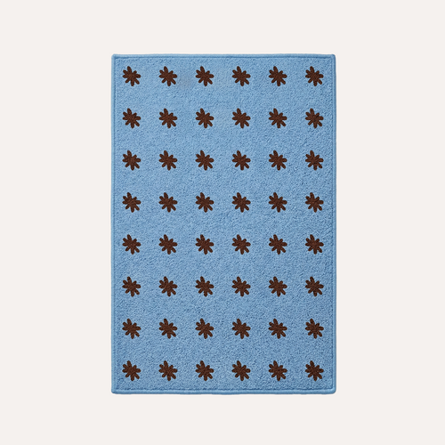 HADDEN Blue rug with brown star patterns on a white background