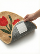 Hand holding a textured product with floral design on a white background