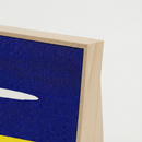 Close-up of the woven sisal showing the tiny house icon and horizon line. High-quality wood frame scratching board