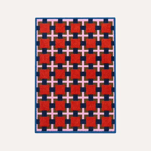 HÄDDEN Lattice cat rug on a warm light background