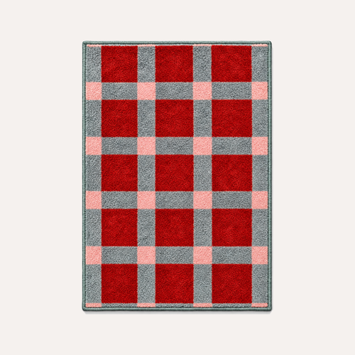HÄDDEN Plaid cat rug on a warm light background