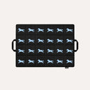 HÄDDEN Nomad Mat in black, a quilted cat travel mat with a light blue galloping horse print and two carry handles